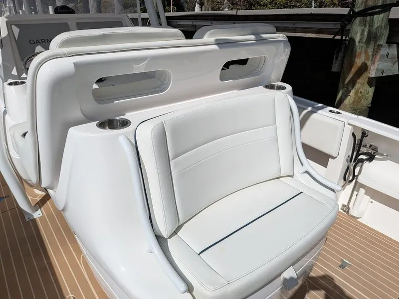Slide: The Image of Intrepid 327 Center Console 2017 boat seating, white upholstery, upgraded motors. - 19