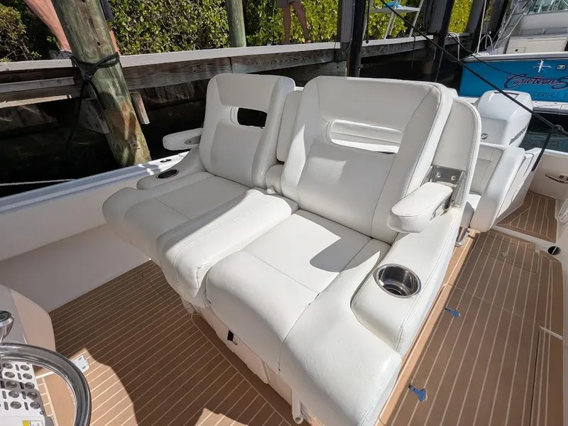 Slide: The Image of Intrepid 327 Center Console 2017 boat with upgraded seating and cup holders. - 21