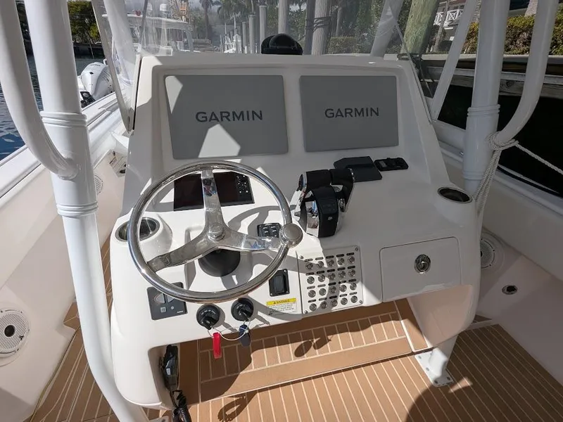 Slide: The Image of Intrepid 327 Center Console 2019 helm with Garmin displays and upgraded controls. - 22