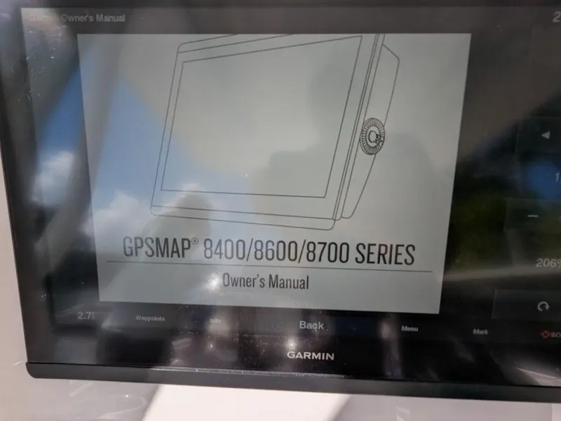 Slide: The Image of Garmin GPSMAP 8400/8600/8700 series owner's manual on Intrepid 327 Center Console. - 27