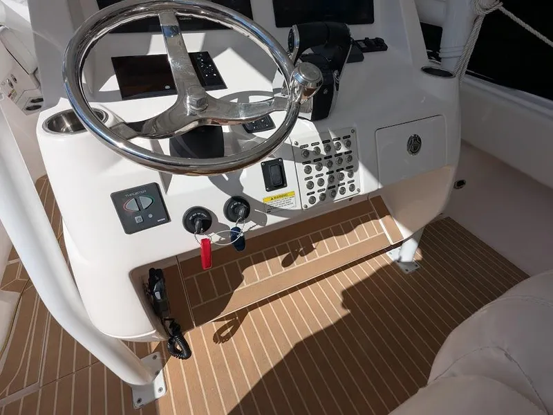 Slide: The Image of Steering console of a 2017 Intrepid 327 Center Console boat with upgraded motors. - 28