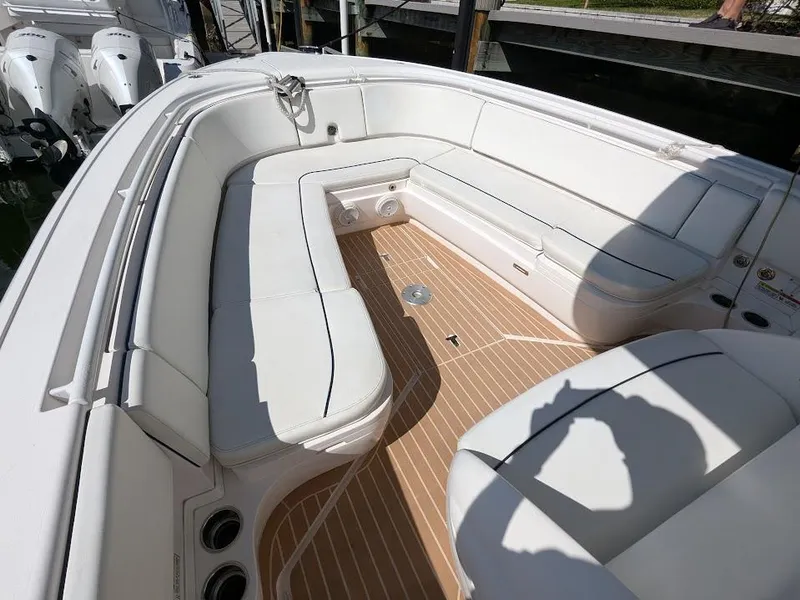 Slide: The Image of Intrepid 327 Center Console 2017 boat with upgraded motors, featuring spacious seating and teak flooring. - 31