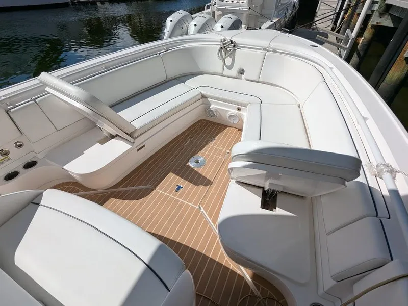 Slide: The Image of Intrepid 327 Center Console 2017 boat with upgraded motors, featuring spacious seating and teak flooring. - 33
