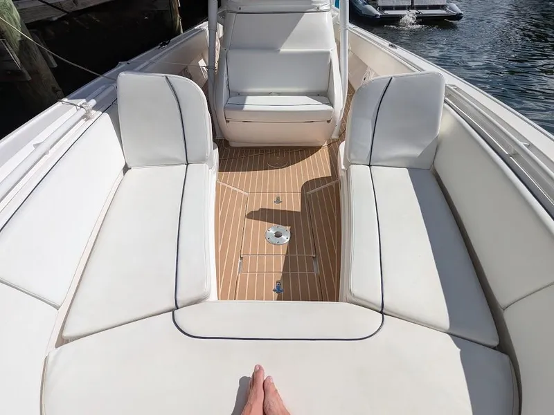 Slide: The Image of Intrepid 327 Center Console 2017 boat interior with upgraded motors, featuring white seating. - 34