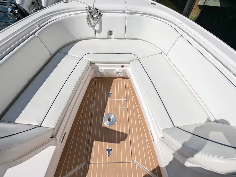 Slide: The Image of Intrepid 327 Center Console 2017 boat with upgraded motors, featuring spacious seating and teak flooring. - 39