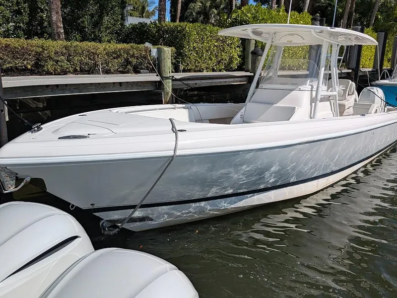 Slide: The Image of Intrepid 327 Center Console 2019 with upgraded motors, docked, side view. - 4