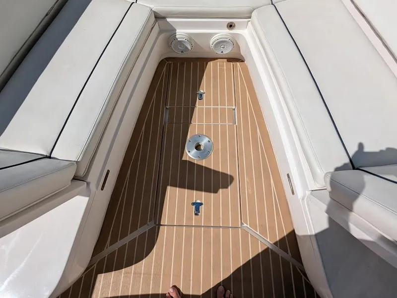 Slide: The Image of Intrepid 327 Center Console 2017 boat interior with teak flooring and white seating. - 40