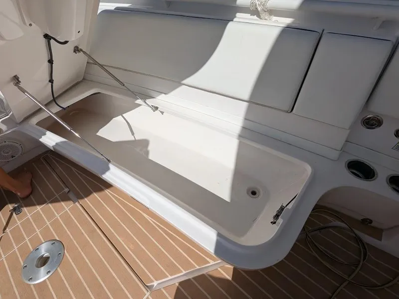 Slide: The Image of Intrepid 327 Center Console 2019, open storage compartment, teak deck, 2017 model. - 43