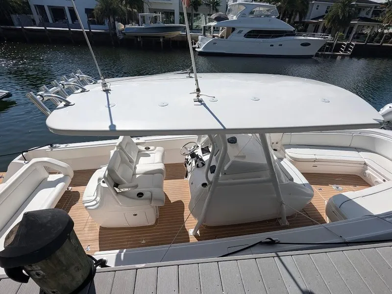 Slide: The Image of Intrepid 327 Center Console boat, 2017 model, docked with upgraded motors, spacious seating, and sleek design. - 6