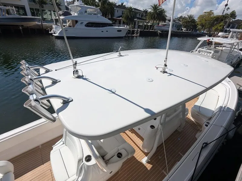 Slide: The Image of Intrepid 327 Center Console 2017 boat with upgraded motors, docked in a marina. - 8