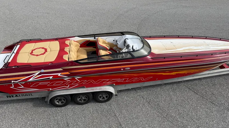 Slide: The Image of 2007 Fountain 42 Lightning speedboat with vibrant red and yellow design on a trailer. - 12