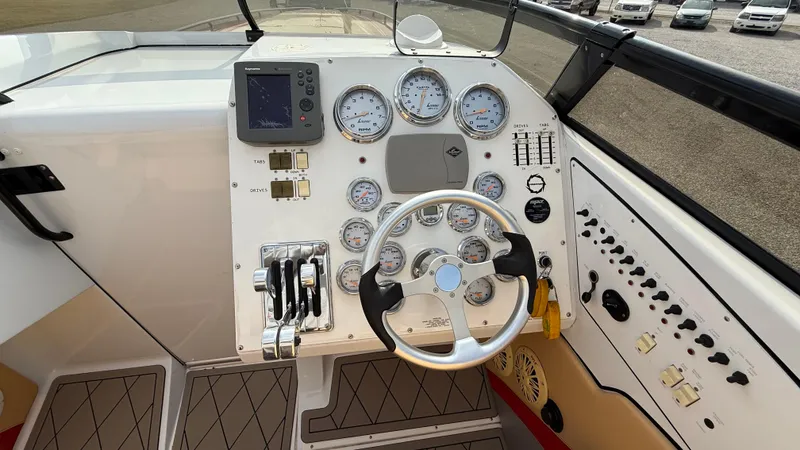 Slide: The Image of 2007 Fountain 42 Lightning boat dashboard with gauges and steering wheel. - 19