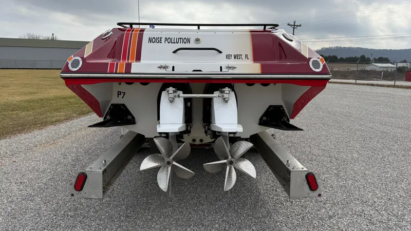 Slide: The Image of 2007 Fountain 42 Lightning boat rear view, featuring dual propellers and vibrant red accents. - 3