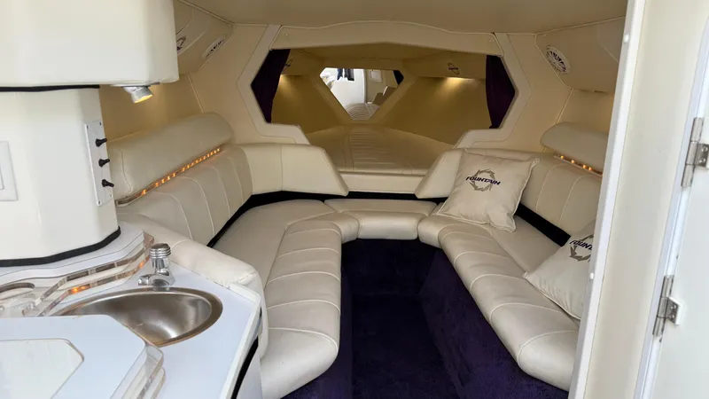 Slide: The Image of Luxurious interior of a 2007 Fountain 42 Lightning boat with plush seating and kitchenette. - 30