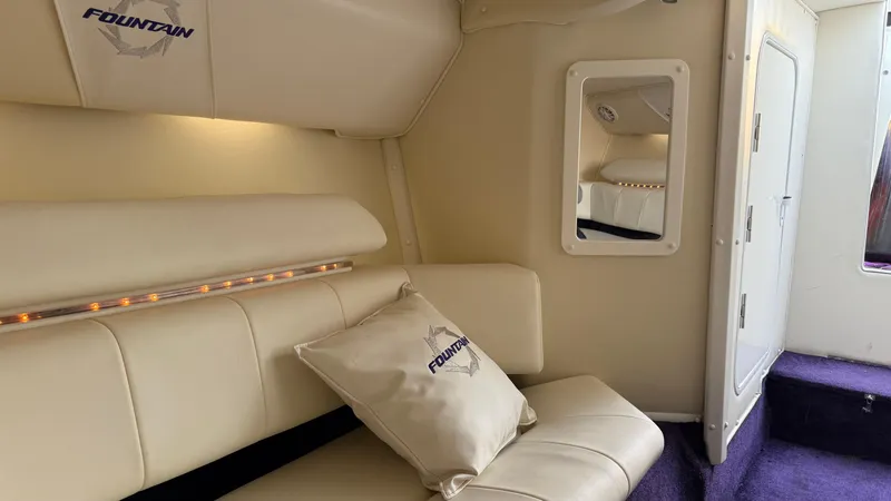 Slide: The Image of Interior of 2007 Fountain 42 Lightning boat with cream seating and mirror. - 32