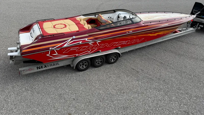 Slide: The Image of 2007 Fountain 42 Lightning speedboat on trailer, red and yellow design, side view. - 9
