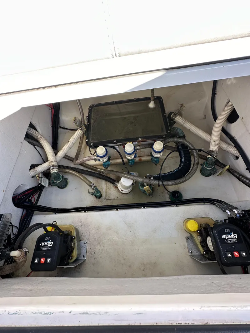 Slide: The Image of 2021 Parker 2600 SH boat engine compartment with hoses and equipment. - 10