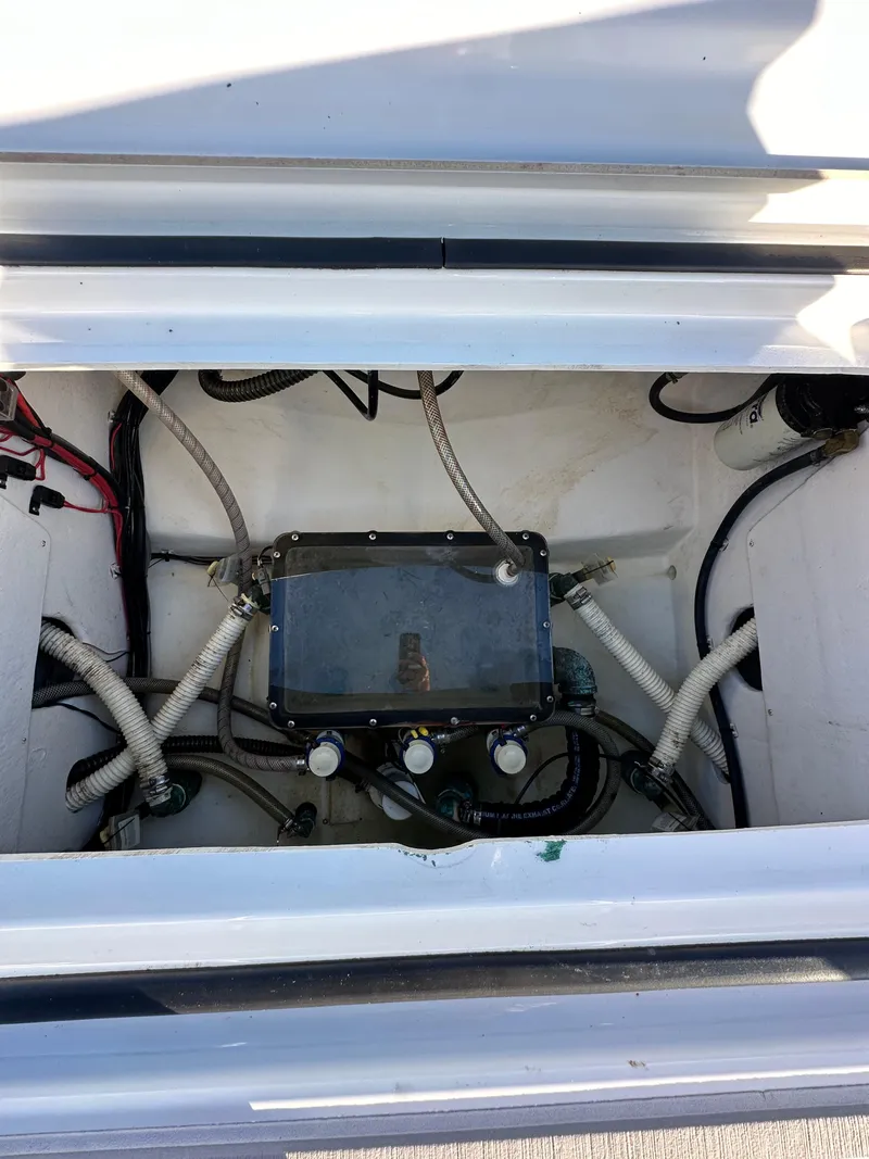Slide: The Image of Parker 2600 SH 2021 boat compartment with wiring and components. - 11
