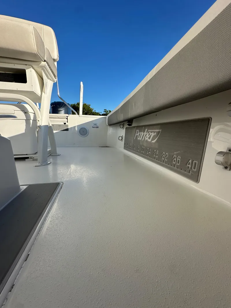 Slide: The Image of 2021 Parker 2600 SH boat interior with seating and clear blue sky. - 20