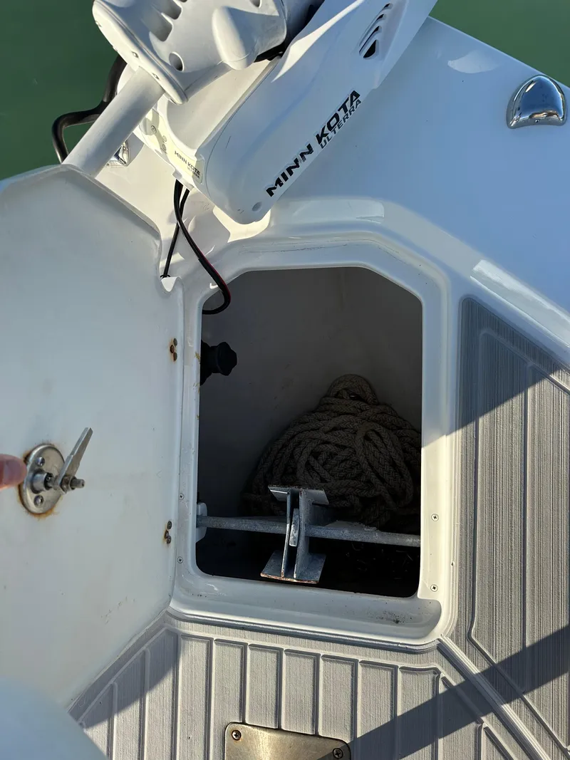 Slide: The Image of Open storage compartment on a 2021 Parker 2600 SH boat with Minn Kota equipment. - 29