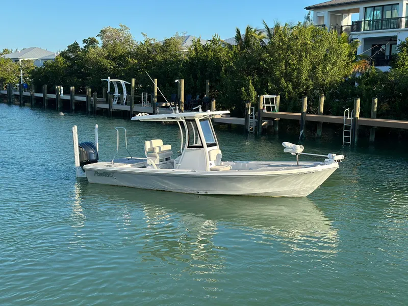 Slide: The Image of 2021 Parker 2600 SH boat on calm water near a dock. - 3