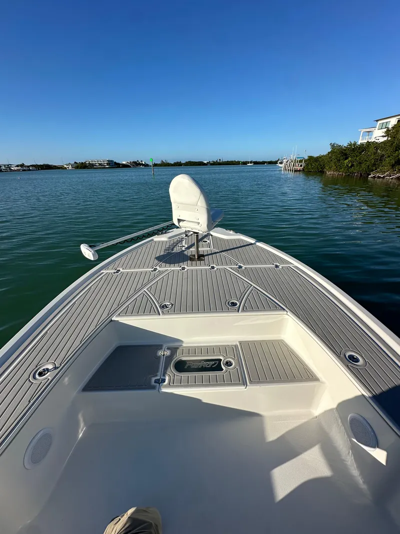 Slide: The Image of 2021 Parker 2600 SH boat on calm water, clear sky, scenic view. - 38