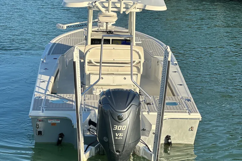 Slide: The Image of 2021 Parker 2600 SH boat with Yamaha 300 V6 engine on calm water. - 4