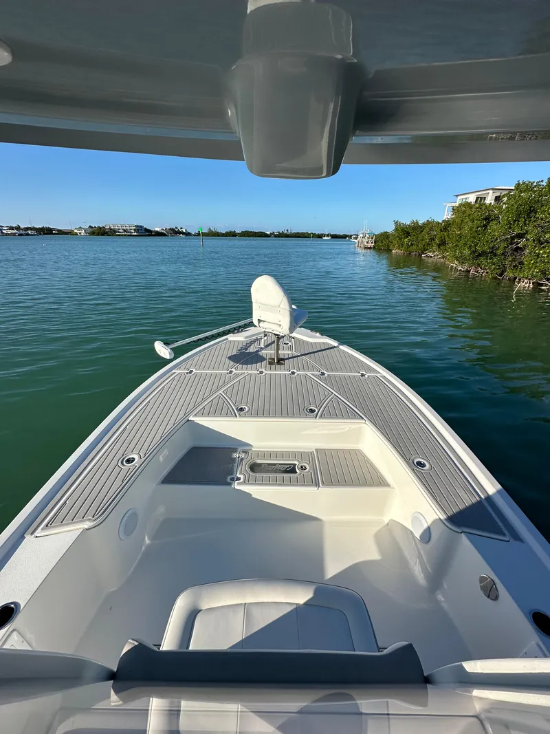 Slide: The Image of 2021 Parker 2600 SH boat on calm water, featuring spacious deck and modern design. - 41