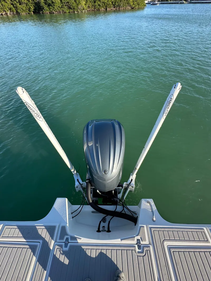 Slide: The Image of Parker 2600 SH 2021 boat engine on calm water, rear view. - 5