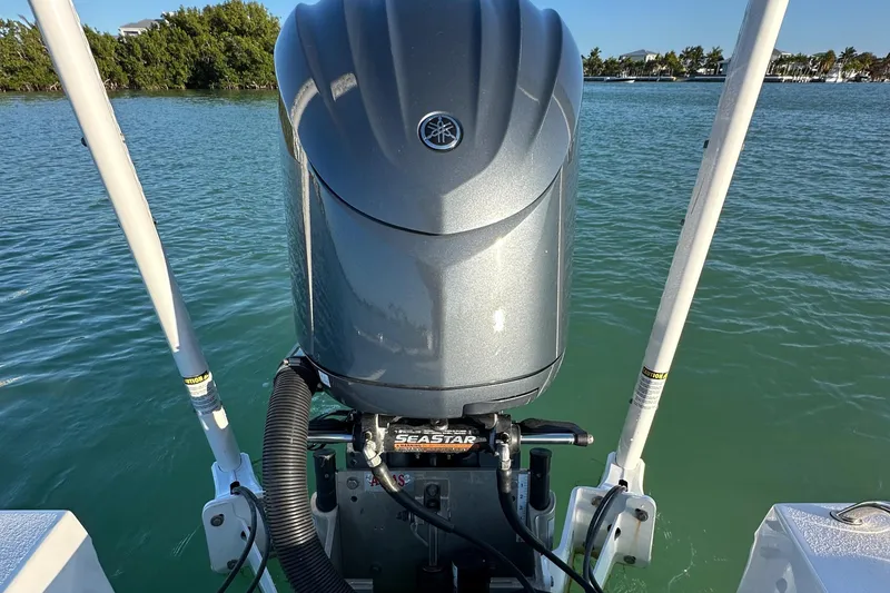 Slide: The Image of Outboard motor on 2021 Parker 2600 SH boat in calm waters. - 6