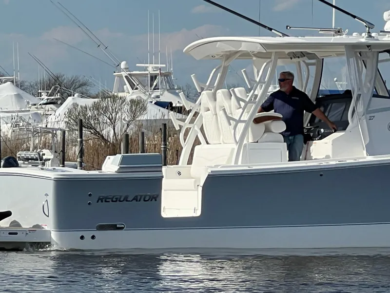 Slide: The Image of 2024 Regulator 37 boat on water, featuring sleek design and modern amenities. - 20