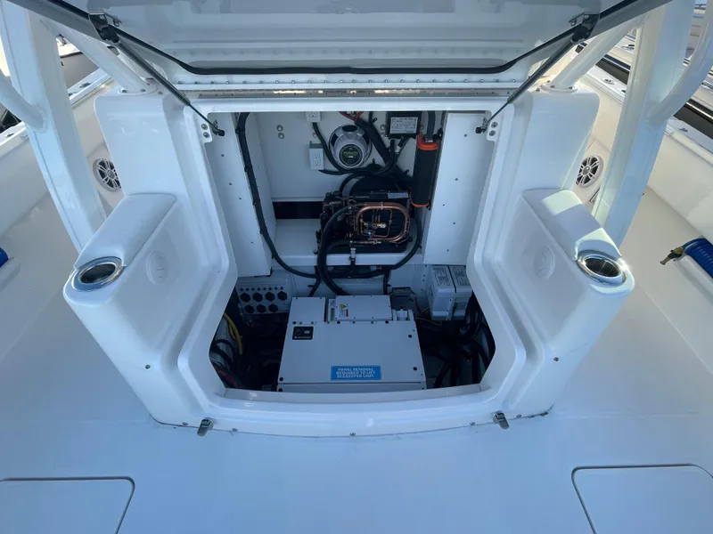 Slide: The Image of 2024 Regulator 37 boat engine compartment with open hatch, showcasing internal components. - 30
