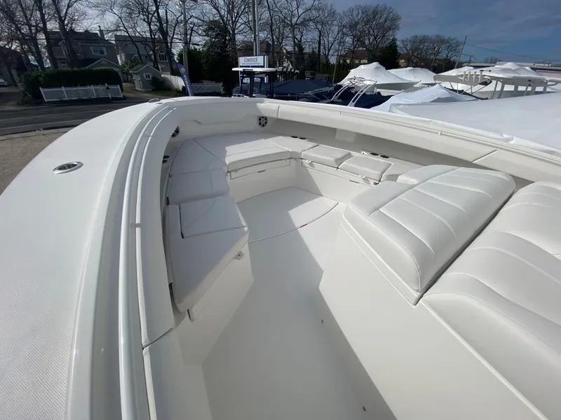 Slide: The Image of 2024 Regulator 37 boat with spacious white seating area. - 38
