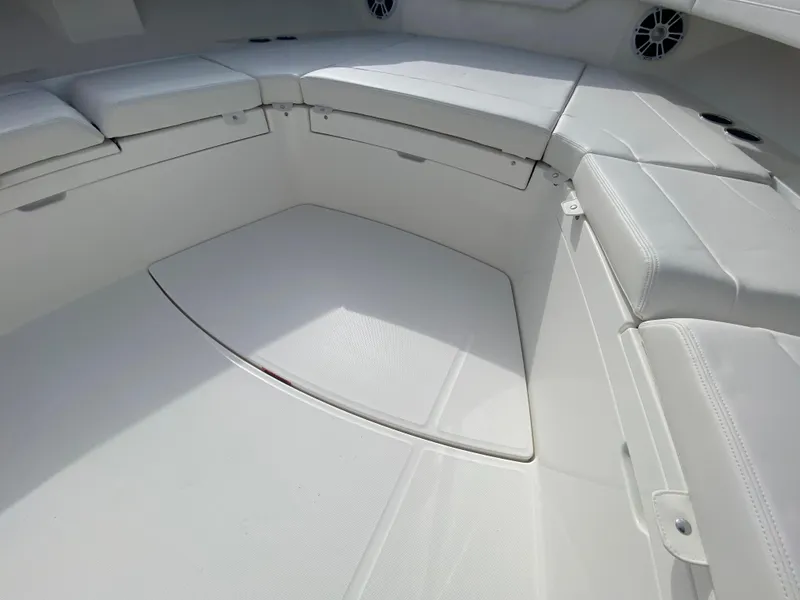 Slide: The Image of 2024 Regulator 37 boat interior with white cushioned seating. - 39