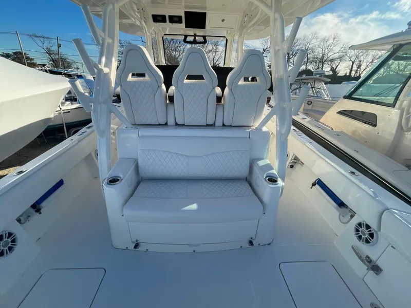 Slide: The Image of 2024 Regulator 37 boat interior with white seating and modern design. - 46