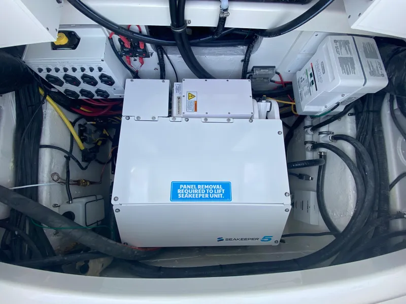 Slide: The Image of 2024 Regulator 37 engine compartment with Seakeeper 5 stabilizer and electrical components. - 48