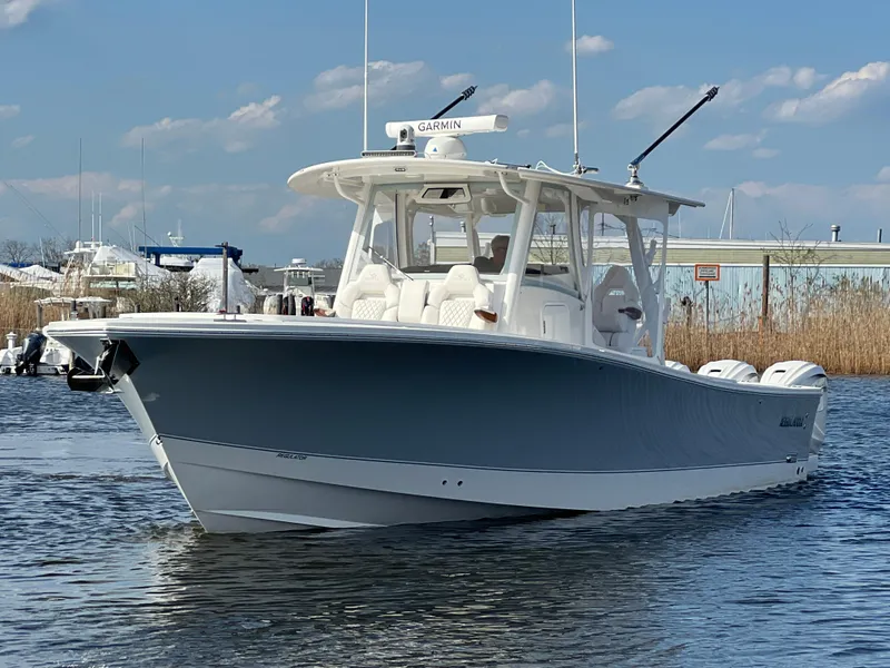 Slide: The Image of 2024 Regulator 37 boat on water, clear sky background. - 8