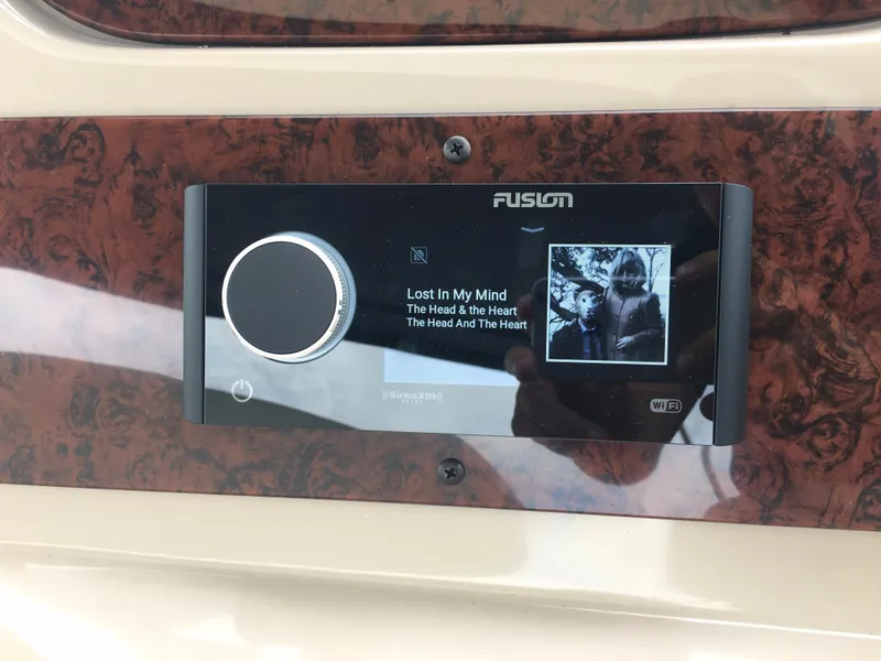 Slide: The Image of Fusion stereo system on a 2000 Sea Ray 410 Sundancer yacht dashboard. - 19