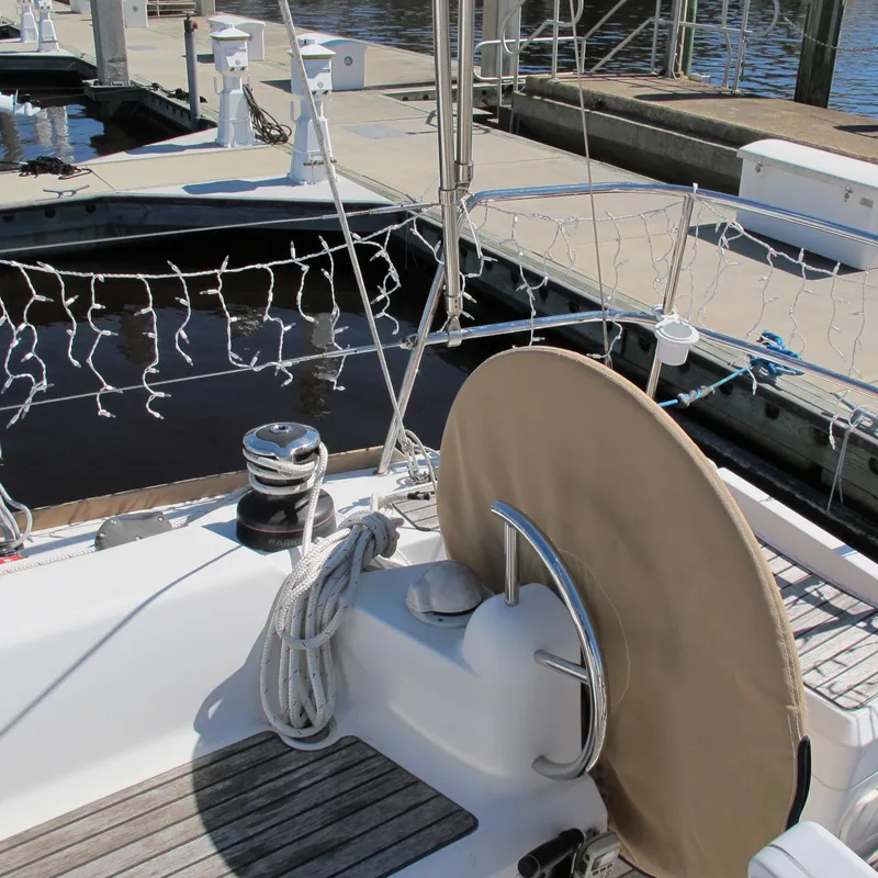 Slide: The Image of Jeanneau Sun Odyssey 379 sailboat docked, showcasing deck and winch, 2013 model. - 17