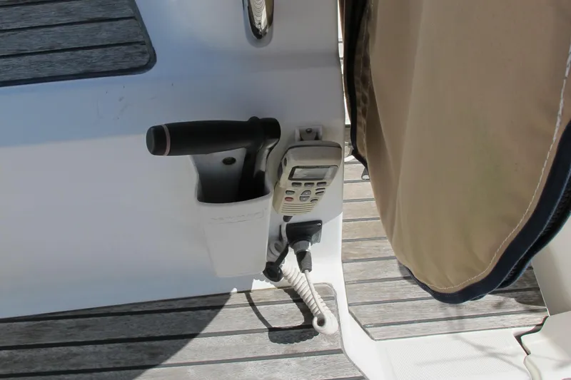 Slide: The Image of Cockpit of 2013 Jeanneau Sun Odyssey 379 with marine radio and throttle control. - 19