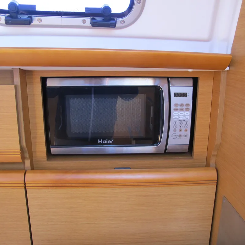Slide: The Image of Microwave in Jeanneau Sun Odyssey 379 yacht kitchen, 2013 model. - 23