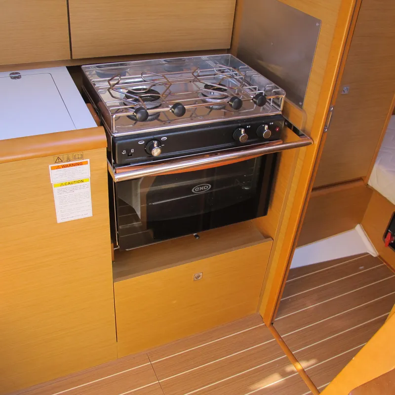 Slide: The Image of 2013 Jeanneau Sun Odyssey 379 yacht kitchen with stove and oven. - 24