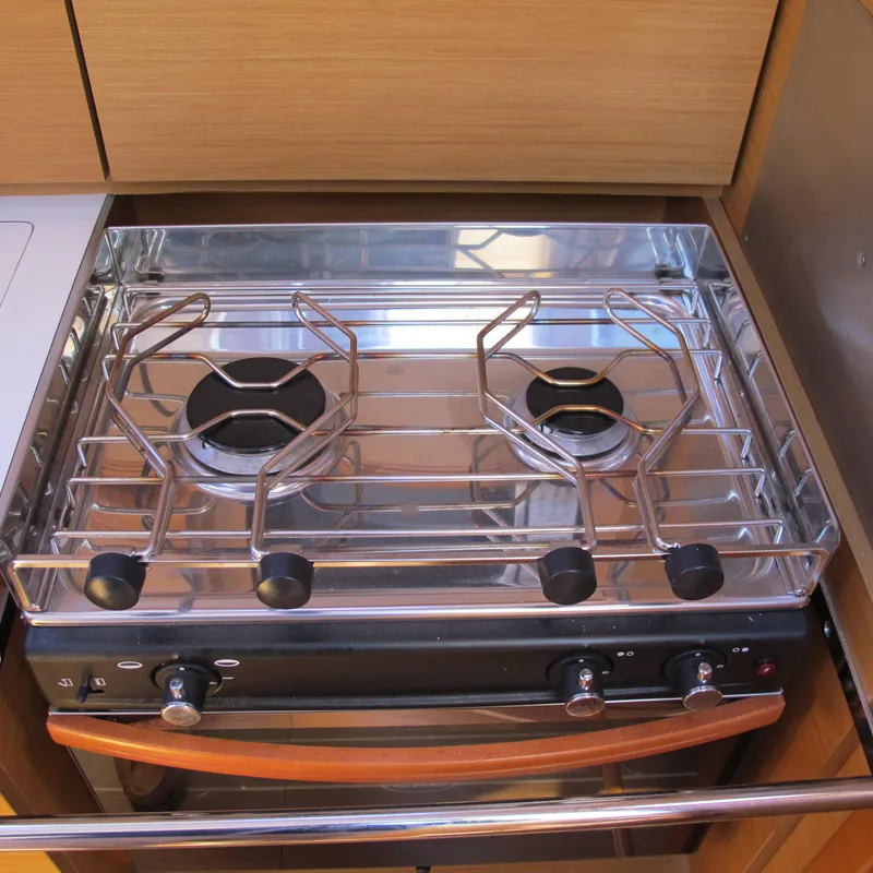 Slide: The Image of Stove in 2013 Jeanneau Sun Odyssey 379 yacht kitchen, featuring two burners and sleek design. - 25