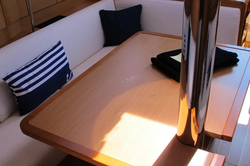 Slide: The Image of Interior of 2013 Jeanneau Sun Odyssey 379 with cozy seating and nautical decor. - 28