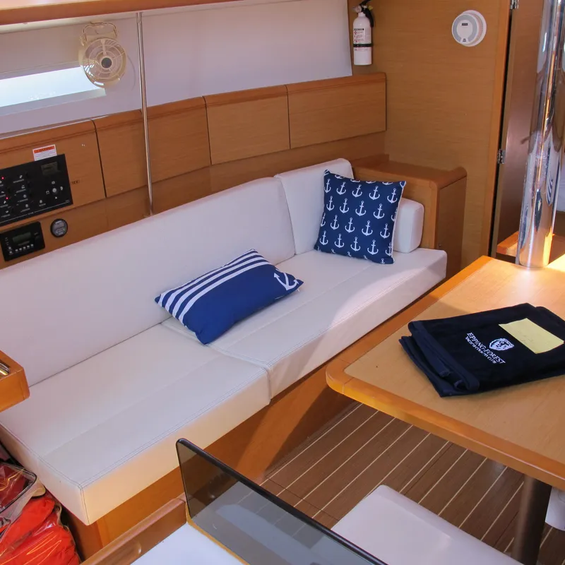 Slide: The Image of Interior of 2013 Jeanneau Sun Odyssey 379 yacht with cozy seating and nautical decor. - 30