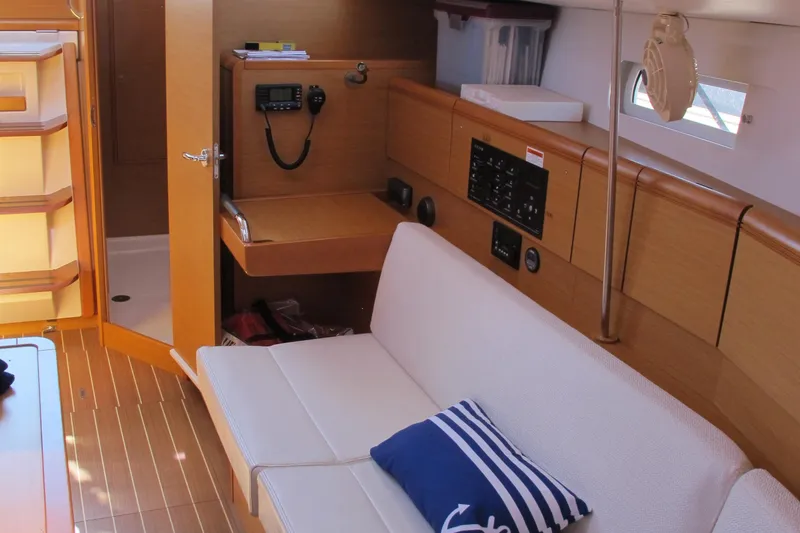 Slide: The Image of Interior of 2013 Jeanneau Sun Odyssey 379 sailboat with seating and navigation equipment. - 31