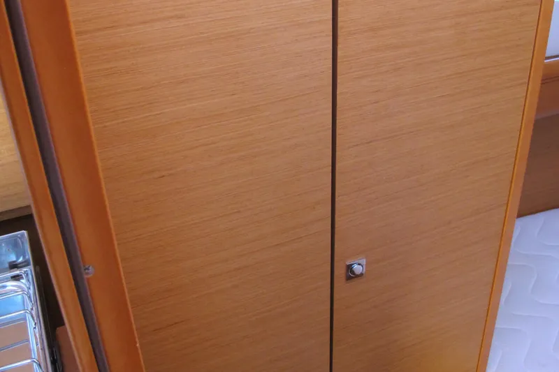 Slide: The Image of Wooden cabinet door inside 2013 Jeanneau Sun Odyssey 379 yacht interior. - 39