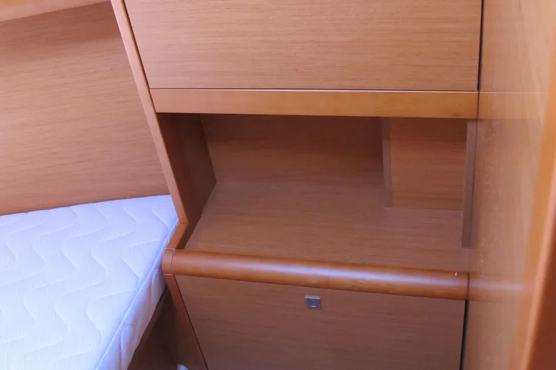 Slide: The Image of Interior cabin of 2013 Jeanneau Sun Odyssey 379 with wooden storage and bed. - 45