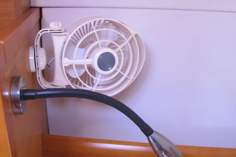Slide: The Image of Wall-mounted fan and light fixture inside 2013 Jeanneau Sun Odyssey 379 yacht cabin. - 47