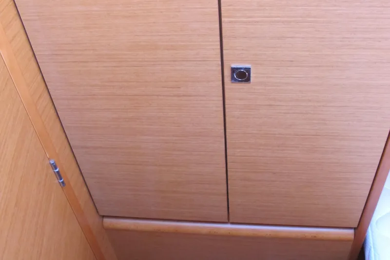 Slide: The Image of Wooden cabinet door inside a 2013 Jeanneau Sun Odyssey 379 sailboat. - 49